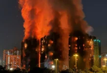 Firefighters search for hundreds missing in Hong Kong tower blocks fire